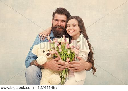 Fabulous Gift For Little One. Happy Family Celebrate Holiday. Little Child And Bearded Man Hold Flow