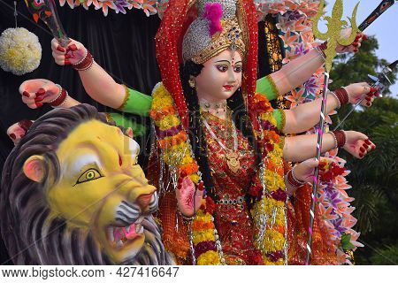 Background Durga Puja Festival And Tableau. Sculpture Of Hindu Goddess Durga