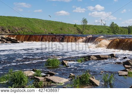 Waterfall On The Tosno River With Rapids And Stony Shore.  Sablino. Leningrad Region. Russia.