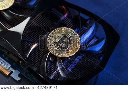 Video Card With A Gold Coin Bitcoin On The Cooler Close-up.
