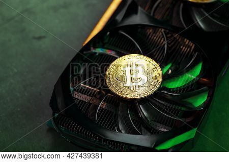 On The Powerful Fans Of The Video Card There Are Coins Of The Bitcoin Cryptocurrency With A Green Ba
