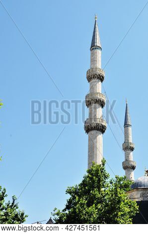 Two Minarets Against The Blue Sky. Minarets In Istanbul. Close-up Of Minarets On A Summer Day.