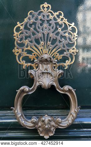 European Vintage Old Metal Wrought Iron Door Knocker. Design Detail. Paris.