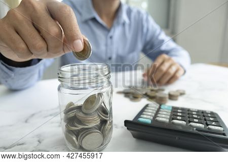 Businessman Saving Money Concept.