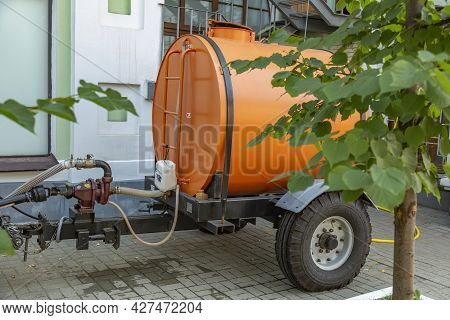 Orange Water Tank For Watering City Streets