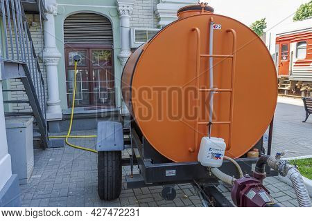 Orange Water Tank For Watering City Streets
