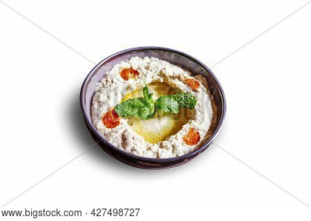 Black Bowl With Moutabal Apetizer Isolated On White