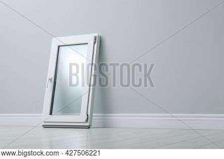 Modern Single Casement Window Near Light Grey Wall Indoors, Space For Text