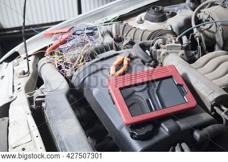 A Scanner For Car Diagnostics.auto Electrician.repair Of Electrical Equipment Of The Car.diagnostics