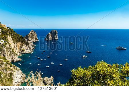 Beautiful Panorama Of Small Bay Full Of Small Ships And Boats Next To 
Faraglioni Di Mezzo
 And Capr