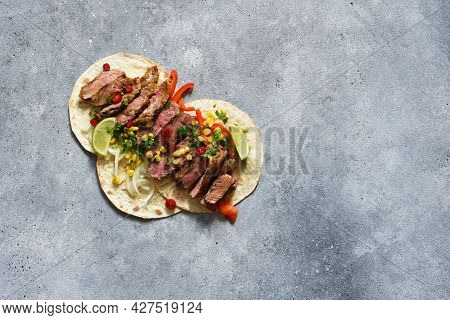 Tacos With Beef, Pepper And Corn With Sauce On A Concrete Background. Traditional Mexican Food.