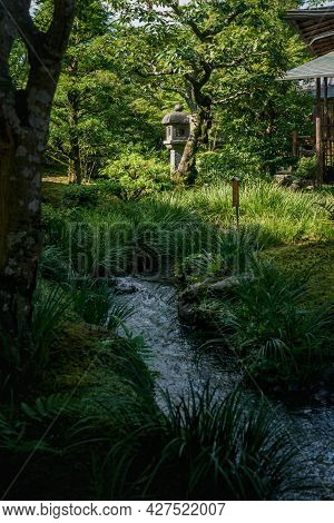 Kyoto, Japan - 18 September 2017: Natural Japanese Zen Garden Sogenchi With Stream Of Water Running 