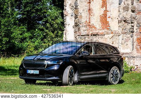 Madona, Latvia - July 20, 2021: New Skoda Enyaq Iv, A Suv Electric Car. Defocused