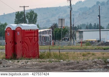 Anaconda, Montana - July 11, 2021: Two Portable Bathrooms (portapotties) Outdoors, At A Construction