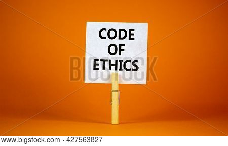 Code Of Ethics Symbol. White Paper With Words 'code Of Ethics', Clip On Wood Clothespin. Beautiful O