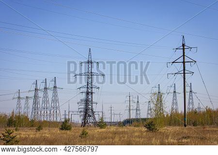 High Voltage Power Line On Industrial Electricity Line Tower. Energy Transmisson With Overhead Power