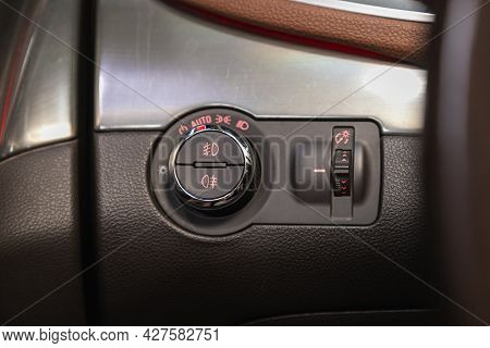 Novosibirsk, Russia - July 15, 2021:   Opel Mokka, Close-up Of The  Headlight Setting Buttons.