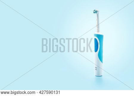 Russia, Moscow, July 22, 2021: Braun Oral-b Toothbrush Head Cross Action. Modern Electric Toothbrush