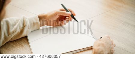 Banner Of A Cacausian Man Hands Writing In A Blank Paper Notebook With A Pen, Project Planning, Maki