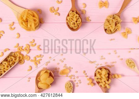 Different Types Of Pasta Close-up On A Colored Background
