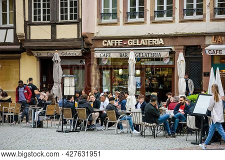 Strasbourg, France - May 20, 2021: People At Terrrace Eating Ice-cream Eating Outside In Central Dis