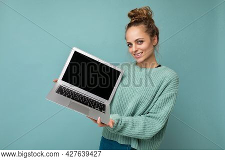 Close-up Portrait Photo Of Beautiful Amiling Dark Blond Young Woman With Gathered Curly Hair Looking