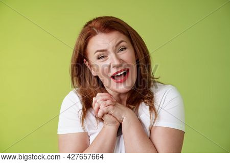 Close-yp Touched Tender Kind Redhead Middle-aged Granny Sighing Look Admiration Delight Clasp Hands 