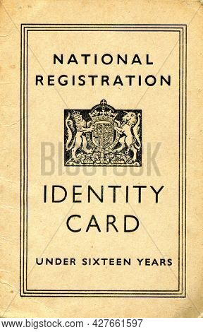 TENTERDEN, ENGLAND - JULY 23, 2021: A British National Identity Card for a child under sixteen. Launched in 1939 at the start of the Second World War, they were discontinued in 1952.