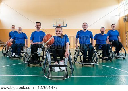 photo of the basketball team of war invalids with professional sports equipment for people with disabilities on the basketball court