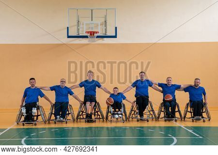 photo of the basketball team of war invalids with professional sports equipment for people with disabilities on the basketball court