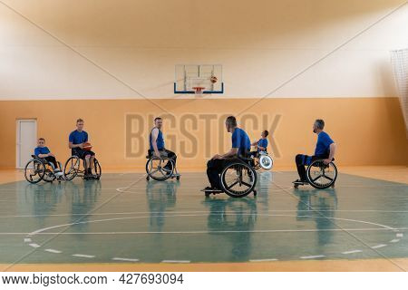 training of the basketball team of war invalids with professional sports equipment for people with disabilities on the basketball court