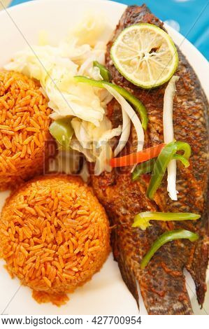 One Of Most Popular Food In Ghana, Jollof Rice, Serve With Fish