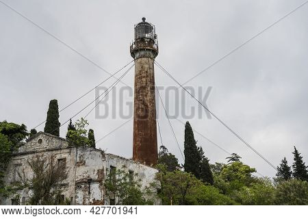 The Old Lighthouse In The City Of Sukhum In The Republic Of Abkhazia. Cloudy Day May 17, 2021