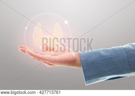 Businesswoman Show Thyroid Protection On A Gray Background