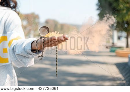 Orange Smoke Billows From The Case From Under The Pocket Watch. A Symbol Of The Transience Of Time. 