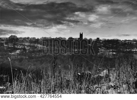 Atmospheric Image Of Snow And Frozen Grass In Front Of The Village Of Heptonstall At Twilight In Hep
