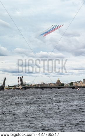 July 22, 2021, Russia, St. Petersburg. Military Aircraft Painted The Sky Over The Neva In The Colors