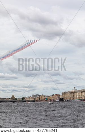 July 22, 2021, Russia, St. Petersburg. Military Aircraft Painted The Sky Over The Neva In The Colors