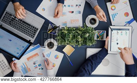 Top View Of Businessman Showing Company Management Statistics Using Digital Tablet Discussing Busine