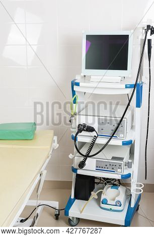 Medical Equipment For Video-esophagogastroduodenoscopy In The Room. A Patients Couch And A Stand Wit