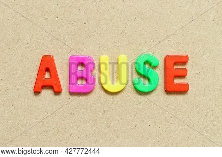 Color Alphabet Letter With Word Abuse On Wood Background