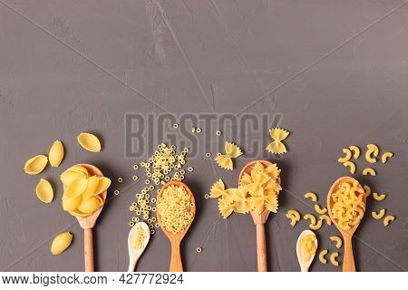 Different Types Of Pasta Close-up On A Colored Background.