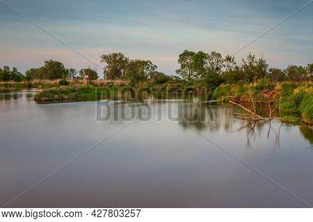 Sunset Over Warta River In Warta Landscape Park, Lad, Poland.