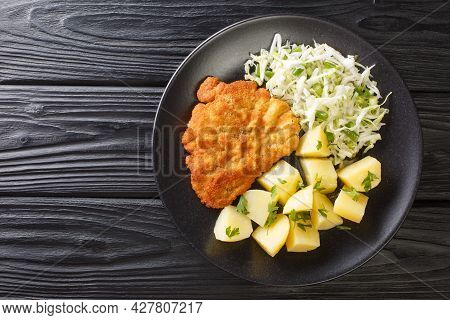 Kotlet Schabowy Polish Breaded Pork With Boiled Potatoes And Cabbage Salad Close-up In A Plate On A 