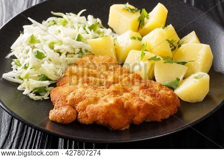 Polish Breaded Pork Cutlets Kotlet Schabowy With Boiled Potatoes And Cabbage Salad Close-up In A Pla