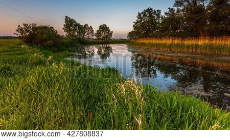 Sunset Over Warta River In Warta Landscape Park, Ladek, Poland.