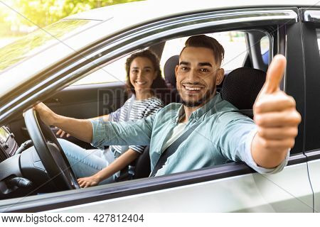 Handsome Arab Guy Sitting Inside Car With Gilfriend
