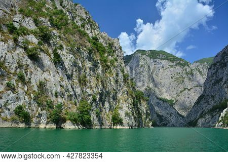 Koman Lake - Reservoir Built On Drin River. The Place Looks Like Norwegian Fiords. Steep Rocky Walls