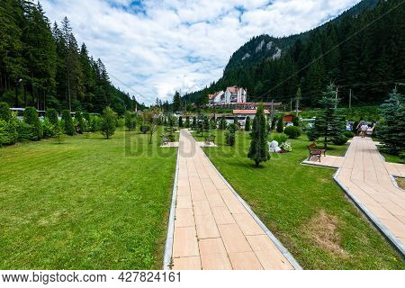 Lacu Rosu, Romania- 25 July 2021: Green, Paved Garden For Tourist At A Local Hotel.