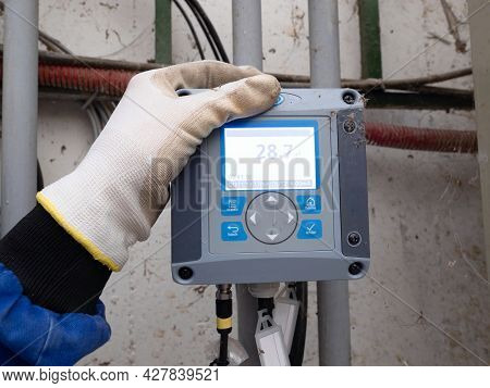 The Industrial Control Panel Shows The Current Temperature. Buttons Around The Display For Changing 